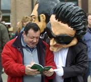 26 April 2005; &quot;Bono&quot; and Michael Drohan, from Waterford, study the race card before the Kildare Hunt Club Steeplechase. Punchestown Racecourse, Co. Kildare. Picture credit; Damien Eagers / SPORTSFILE