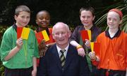 27 April 2005; The Kilkenny manager Brian Cody with Allianz Junior Whistlers, left to right, Paul Gallagher, aged 12, Holy Trinity National School, Bambi Fasanya, aged 11, Donaghmeade National School, Joseph McCarthy, aged 12 and Niamh Fallon, aged 11, both from St. Helens, Portmarnock,  after a media conference ahead of the Allianz Football & Hurling League Division 1 finals. Berkley Court Hotel, Dublin. Picture credit; David Maher / SPORTSFILE