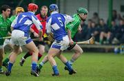 23 April 2005; Andrew O'Shaughnessy, Limerick, in action against Michael McEvoy, left, and Canice Coonan, Laois. Allianz National Hurling League, Division 1 Relegation Section, Limerick v Laois, John Fitzgerald Park, Kilmallock, Co. Limerick. Picture credit; Kieran Clancy / SPORTSFILE