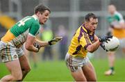 12 January 2014; Conor Carty, Wexford, in action against John Maloney, Offaly. Bord na Mona O'Byrne Cup, Group A, Round 3, Offaly v Wexford, O'Connor Park, Tullamore, Co. Offaly. Picture credit: Barry Cregg / SPORTSFILE