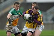 12 January 2014; Paddy Byrne, Wexford, in action against Ruairi Allen, left, and John Maloney, Offaly. Bord na Mona O'Byrne Cup, Group A, Round 3, Offaly v Wexford, O'Connor Park, Tullamore, Co. Offaly. Picture credit: Barry Cregg / SPORTSFILE