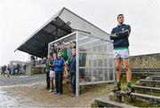 12 January 2014; Leitrim's Damian Moran braves the rain after being substituted while the rest of the Leitrim substitutes shelter under the team bench. FBD League, Section B, Round 2, Galway v Leitrim, Duggan Park, Ballinasloe, Co. Galway. Picture credit: Diarmuid Greene / SPORTSFILE