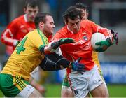 12 January 2014; Jamie Clarke, Armagh, in action against Neil McGee, Donegal. Power NI Dr. McKenna Cup, Section A, Round 2, Armagh v Donegal, Athletic Grounds, Armagh. Picture credit: Oliver McVeigh / SPORTSFILE