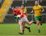 12 January 2014; Ciaran Rafferty, Armagh, in action against Darragh O'Connor, Donegal. Power NI Dr. McKenna Cup, Section A, Round 2, Armagh v Donegal, Athletic Grounds, Armagh. Picture credit: Oliver McVeigh / SPORTSFILE