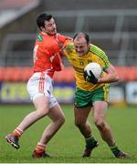 12 January 2014; Colm McFadden, Donegal, in action against Stefan Forker, Armagh. Power NI Dr. McKenna Cup, Section A, Round 2, Armagh v Donegal, Athletic Grounds, Armagh. Picture credit: Oliver McVeigh / SPORTSFILE