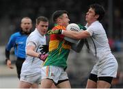12 January 2014; Kieran Nolan, Carlow, in action against Emmet Bolton, right, and Adam Tyrrell, Kildare. Bord na Mona O'Byrne Cup, Group B, Round 3, Kildare v Carlow, St Conleth's Park, Newbridge, Co. Kildare. Picture credit: Piaras Ó Mídheach / SPORTSFILE