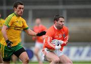 12 January 2014; Eugene McVerry, Armagh, in action against Declan Walsh, Donegal. Power NI Dr. McKenna Cup, Section A, Round 2, Armagh v Donegal, Athletic Grounds, Armagh. Picture credit: Oliver McVeigh / SPORTSFILE