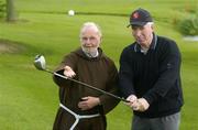 28 April 2005; Fachtna Murphy, Assistant Commissioner of An Garda Siochana, with Brother Kevin Crowley OFM Cap, Director of the Capuchin Day Centre, at the start of the Bridewell Garda Golf Classic in aid of the Capuchin Day Centre. The Day Centre, which operates from the back of the Capuchin Friary in Church St., Dublin 7, provides up to 300 hot meals a day, food parcels, and other services for homeless and needy people six days of the week, completely free of charge. St. Margarets Golf and Country Club, Dublin. Picture credit; Damien Eagers / SPORTSFILE