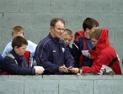 28 April 2005; Republic of Ireland manager Brian Kerr signs autographs for fans as he watches the match. U16 Friendly International, Republic of Ireland U16 v Sweden U16, Whitehall, Dublin. Picture credit; Brian Lawless / SPORTSFILE