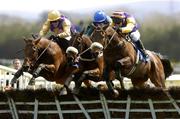 29 April 2005; Brave Inca, left, with Tony McCoy up, jumps the last on their way to winning the Emo Oil Champion Hurdle Macs Joy, with Barry Geraghty, who finished third, Harchibald, right, with Paul Carberry, who finished second. Punchestown Racecourse, Co. Kildare. Picture credit; Matt Browne / SPORTSFILE