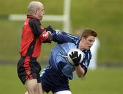 30 April 2005; Ger O'Meara, Dublin, is tackled by Eoin Henry, Down. Cadbury's All-Ireland U21 Football Semi-Final, Dublin v Down, Pairc Tailteann, Navan, Co. Meath. Picture credit; Matt Browne / SPORTSFILE