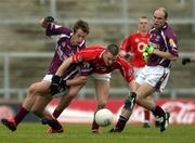 30 April 2005; David Limerick, Cork, in action against Sean Armstrong and Darren Mullahy, right, Galway. Cadbury's All-Ireland U21 Football Semi-Final, Cork v Galway, Gaelic Grounds, Limerick. Picture credit; Ray McManus / SPORTSFILE