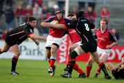 30 April 2005; Mike Mullins, Munster, is tackled by Simon Taylor, Edinburgh Rugby. Celtic Cup 2004-2005, Quarter-Final, Munster v Edinburgh Rugby, Thomond Park, Limerick. Picture credit; Kieran Clancy / SPORTSFILE