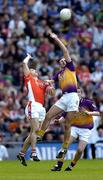 1 May 2005; David Fogarty, Wexford, in action against Paul McGrane, Armagh. Allianz National Football League, Division 1 Final, Armagh v Wexford, Croke Park, Dublin. Picture credit; Brendan Moran / SPORTSFILE