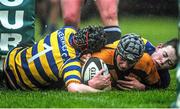 14 January 2014; David Fox, St. Patrick's Classical School, Navan, is held up before the try line by Cian Nolan, left, and Luke Breen, Skerries C.C. Fr. Godfrey Cup, 1st Round, St. Patrick's Classical School, Navan v Skerries C.C, Ashbourne RFC, Ashbourne, Co. Meath. Picture credit: Ramsey Cardy / SPORTSFILE