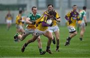 12 January 2014; Brian Malone, Wexford, in action against Johnny Brickland, Offaly. Bord na Mona O'Byrne Cup, Group A, Round 3, Offaly v Wexford, O'Connor Park, Tullamore, Co.Offaly. Picture credit: Barry Cregg / SPORTSFILE
