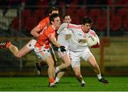 15 January 2014; Ronan O'Neill, Tyrone, in action against Mark Shields, Armagh. Power NI Dr. McKenna Cup, Section A, Round 3, Tyrone v Armagh, Healy Park, Omagh, Co. Tyrone. Picture credit: Oliver McVeigh / SPORTSFILE