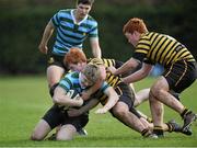 16 January 2014; Robie Toal Lennon, St Gerard's School, is tackled by Daire Meegan, centre, and Ronan Meegan, right, St Patrick's Classical School. Vinny Murray Cup sponsored by Beauchamps, 2nd Round, St Patrick's Classical School v St Gerard's School, Westmanstown, Co. Dublin. Picture credit: Barry Cregg / SPORTSFILE