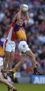 1 May 2005; Redmond Barry, Wexford, in action against Paul McCormack, Armagh. Allianz National Football League, Division 1 Final, Armagh v Wexford, Croke Park, Dublin. Picture credit; Brendan Moran / SPORTSFILE