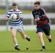 17 January 2014; Eric Nolan, Knockbeg College, in action against Darragh Scanlon, Portmarnock Community School. Leinster Schools Senior A Football Championship, Round 1, Knockbeg College v Portmarnock Community School, Dr. Cullen Park, Carlow. Picture credit: Matt Browne / SPORTSFILE