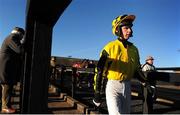11 January 2014; Jockey Paddy Kennedy makes his way to the parade ring. Punchestown Racecourse, Punchestown, Co. Kildare. Picture credit: Ramsey Cardy / SPORTSFILE