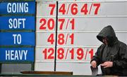 18 January 2014; A racecourse official marks the bookmakers odds board ahead of the Book Hospitality On Line Maiden Hurdle. Naas Racecourse, Naas, Co. Kildare. Picture credit: Barry Cregg / SPORTSFILE