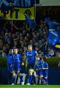 17 January 2014; Jamie Heaslip walks onto the pitch with the mascots. Heineken Cup 2013/14, Pool 1, Round 6, Leinster v Ospreys, RDS, Ballsbridge Dublin. Picture credit: Ramsey Cardy / SPORTSFILE
