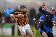 18 January 2014; John Joe Farrell, Kilkenny, shoots to score his side's second goal despite the efforts of  DIT goalkeeper Finn McGarry. Bord Na Mona Walsh Cup Quarter-Final, DIT v Kilkenny, St. Lachtain's GAA Club, Freshford, Co. Kilkenny. Photo by Sportsfile