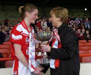 30 April 2005; Cork captain Juliette Murphy is presented with the trophy by Geraldine Giles, President, Cumann Peil Gael na mBan. Suzuki Ladies National Football League, Division 1 Final, Cork v Galway, Gaelic Grounds, Limerick. Picture credit; Ray McManus / SPORTSFILE