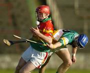 7 May 2005; Damien Roberts, Carlow, in action against Brian Carroll, Offaly. Allianz National Hurling League, Division 2 Final, Offaly v Carlow, O' Moore Park, Portlaoise, Co. Laois. Picture credit; Ray McManus / SPORTSFILE