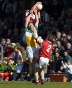 8 May 2005; Neville Coughlan, Offaly, in action against Ronan Caroll and Alan Page, (2), Louth. Bank of Ireland All-Ireland Senior Football Championship, Offaly v Louth, Pairc Tailteann, Navan, Co. Meath. Picture credit; Damien Eagers / SPORTSFILE