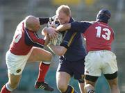 8 May 2005; Des Dillon, Leinster, is tackled by Paul Burke, left, and Mike Mullins, Munster. Celtic Cup 2004-2005 Semi-Final, Leinster v Munster, Lansdowne Road, Dublin. Picture credit; Brendan Moran / SPORTSFILE