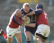 8 May 2005; Des Dillon, Leinster, is tackled by Paul Burke, left, and Mike Mullins, Munster. Celtic Cup 2004-2005 Semi-Final, Leinster v Munster, Lansdowne Road, Dublin. Picture credit; Brendan Moran / SPORTSFILE