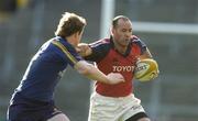 8 May 2005; Mike Mullins, Munster, is tackled by Brian O'Driscoll, Leinster. Celtic Cup 2004-2005 Semi-Final, Leinster v Munster, Lansdowne Road, Dublin. Picture credit; Brendan Moran / SPORTSFILE