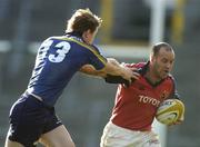 8 May 2005; Mike Mullins, Munster, is tackled by Brian O'Driscoll, Leinster. Celtic Cup 2004-2005 Semi-Final, Leinster v Munster, Lansdowne Road, Dublin. Picture credit; Brendan Moran / SPORTSFILE