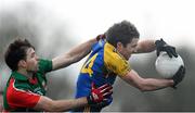 19 January 2014; Cathal Cregg, Roscommon, in action against Ger Cafferkey, Mayo. FBD League, Section A, Round 3, Roscommon v Mayo, Michael Glaveys GAA Club, Ballinlough, Co. Roscommon. Picture credit: David Maher / SPORTSFILE