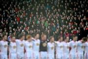 19 January 2014; Spectators stand for the National Anthem before the match. Power NI Dr. McKenna Cup, Semi-Final, Tyrone v Derry, Healy Park, Omagh, Co. Tyrone. Picture credit: Ramsey Cardy / SPORTSFILE