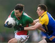 19 January 2014; Keith Higgins, Mayo, in action against Niall Carty, Roscommon. FBD League, Section A, Round 3, Roscommon v Mayo, Michael Glaveys GAA Club, Ballinlough, Co. Roscommon. Picture credit: David Maher / SPORTSFILE