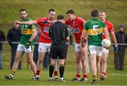 19 January 2014; Paul Kerrigan, 2nd from left, and Fintan Goold remonstrate with referee Derek O'Mahony before Goold was shown a black card. McGrath Cup Final, Cork v Kerry, Mallow GAA Grounds, Mallow, Co. Cork. Picture credit: Brendan Moran / SPORTSFILE