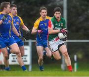 19 January 2014; Alan Freeman, Mayo, in action against Niall Daly, Conor Daly and Niall Carty, Roscommon. FBD League, Section A, Round 3, Roscommon v Mayo, Michael Glaveys GAA Club, Ballinlough, Co. Roscommon. Picture credit: David Maher / SPORTSFILE