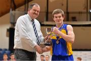 21 January 2014; Patrician HS Carrickmacross captain Sean Marron is presented with the cup by Bernard O'Byrne, Chief Executive, Basketball Ireland. All-Ireland Schools Cup U19B Boys Final, St Colmcilles Knocklyon, Co. Dublin v Patrician HS, Carrickmacross, Co Monaghan, National Basketball Arena, Tallaght, Co. Dublin. Picture credit: Brendan Moran / SPORTSFILE