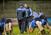 21 January 2014; Dublin Manager Anthony Daly watches his team warm down after the match. Bord na Mona Walsh Cup, Quarter-Final, Dublin v UCD, Parnell Park, Dublin. Picture credit: Ramsey Cardy / SPORTSFILE