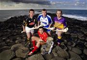 10 May 2005; &quot;The Stuff of Legend&quot;: Pictured at a photocall, at the Giants Causeway, Co. Antrim, to launch the Guinness All-Ireland Senior Hurling Championship 2005 are, l to r, James McGarry, Kilkenny, Sean Og O hAilpin, Cork, Eoin Kelly, Waterford, and Michael Jacob, Wexford. This year's Guinness advertising campaign for the Hurling Championship will focus on Irish myths and legends, with one of the executions in the campaign featuring Fionn Mac Cumhaill at the Giants Causeway. The advertising campaign will break on the 23rd May. Picture credit; Brendan Moran / SPORTSFILE