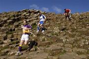 10 May 2005; &quot;The Stuff of Legend&quot;: Pictured at a photocall, at the Giants Causeway, Co. Antrim, to launch the Guinness All-Ireland Senior Hurling Championship 2005 are, l to r, Michael Jacob, Wexford, Eoin Kelly, Waterford, and Sean Og O hAilpin, Cork. This year's Guinness advertising campaign for the Hurling Championship will focus on Irish myths and legends, with one of the executions in the campaign featuring Fionn Mac Cumhaill at the Giants Causeway. The advertising campaign will break on the 23rd May. Picture credit; Ray McManus / SPORTSFILE