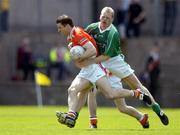 15 May 2005; Paul McGrane, Armagh, is tackled by Liam McBarron, Fermanagh. Bank Of Ireland Ulster Senior Football Championship, Armagh v Fermanagh, St. Tighernach's Park, Clones, Co. Monaghan. Picture credit; Brendan Moran / SPORTSFILE