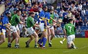 15 May 2005; Players from both sides, l to r, Eoin Kelly, Tipperary, Stephen Lucey, Limerick, Mark Foley, L, Damien Reale, L, Ger O'Grady, T, John Devane, T, Brian Geary, L, and Peter Lawlor, L, watch as Devane's shot goes goalwards. Guinness Munster Senior Hurling Championship Quarter-Final, Tipperary v Limerick, Semple Stadium, Thurles, Co. Tipperary. Picture credit; Ray McManus / SPORTSFILE