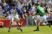 15 May 2005; The Tipperary goalkeeper Brendan Cummins prepares to clear under pressure from Andrew O'Shaughnessy, Limerick. Guinness Munster Senior Hurling Championship Quarter-Final, Tipperary v Limerick, Semple Stadium, Thurles, Co. Tipperary. Picture credit; David Levingstone / SPORTSFILE