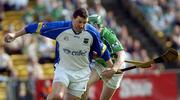 15 May 2005; The Tipperary goalkeeper Brendan Cummins prepares to clear under pressure from Andrew O'Shaughnessy, Limerick. Guinness Munster Senior Hurling Championship Quarter-Final, Tipperary v Limerick, Semple Stadium, Thurles, Co. Tipperary. Picture credit; David Levingstone / SPORTSFILE