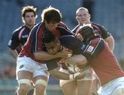 14 May 2005; Salesi Finau, Llanelli Scarlets, is tackled by Donnacha O'Callaghan, left, and Paul O'Connell, Munster. Celtic Cup 2004-2005 Final, Munster v Llanelli Scarlets, Lansdowne Road, Dublin. Picture credit; Brendan Moran / SPORTSFILE