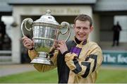 23 January 2014; Jockey Paul Townend with the Thyestes Cup after winning the Goffs Thyestes Handicap Steeplechase on On His Own. Gowran Park, Gowran, Co. Kilkenny. Picture credit: Matt Browne / SPORTSFILE